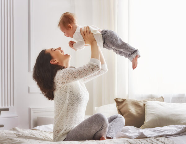 Mother and baby laughing