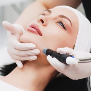 Patient receiving a Hydrafacial™ treatment with a skincare professional using the Hydrafacial device for glowing, hydrated skin